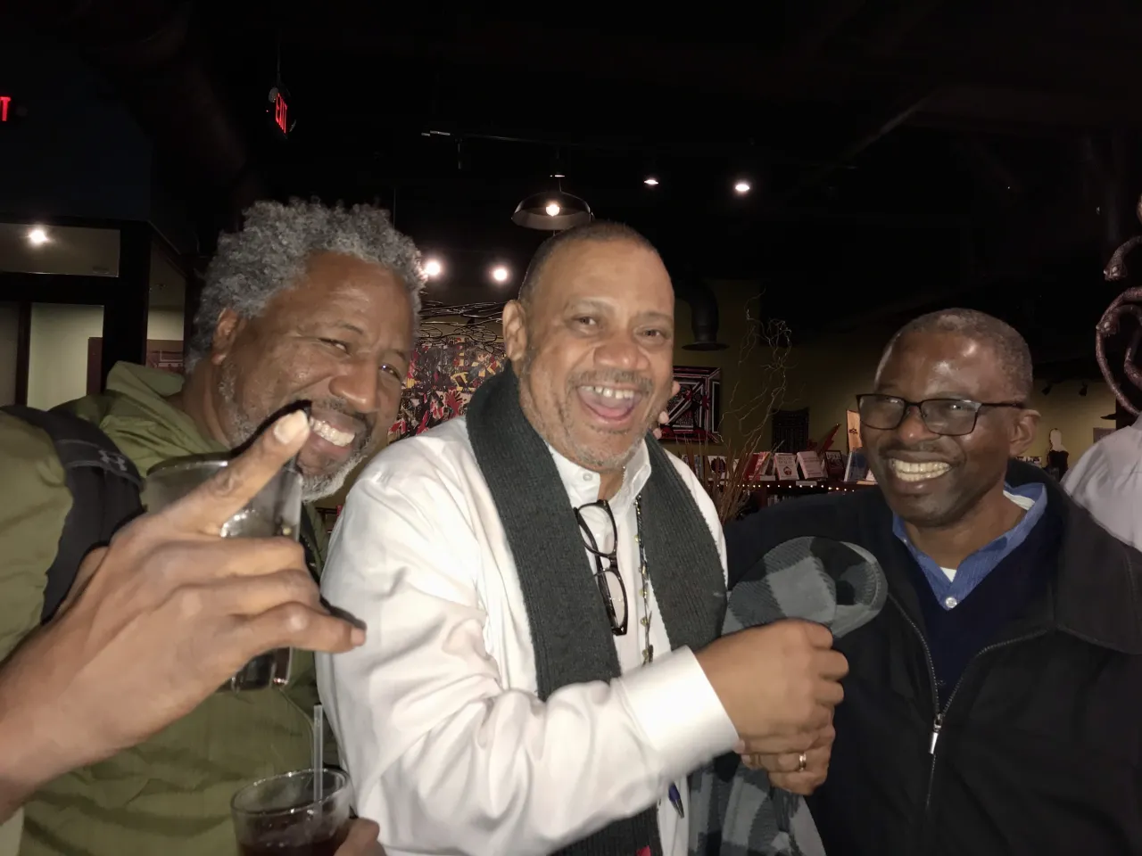 Three men posing for a photo