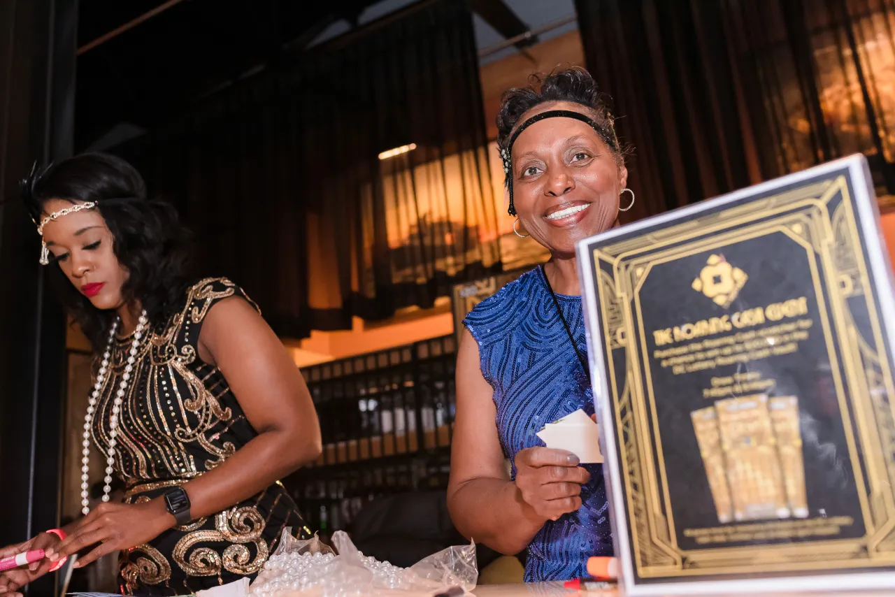 Two women collecting entry forms