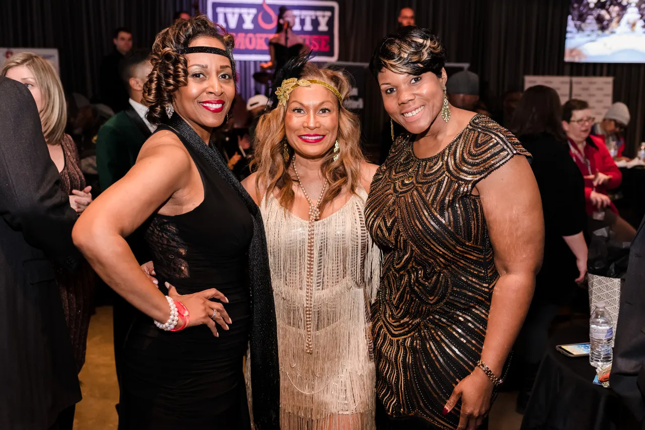 Three women posing for a photo