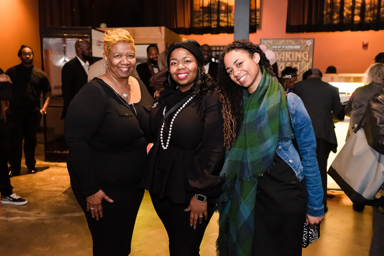 Three women posing for a photo