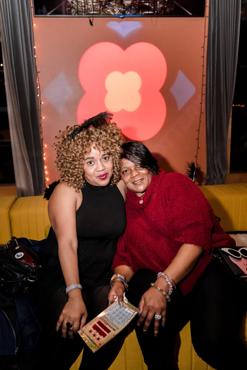 Two women posing for a photo in VIP