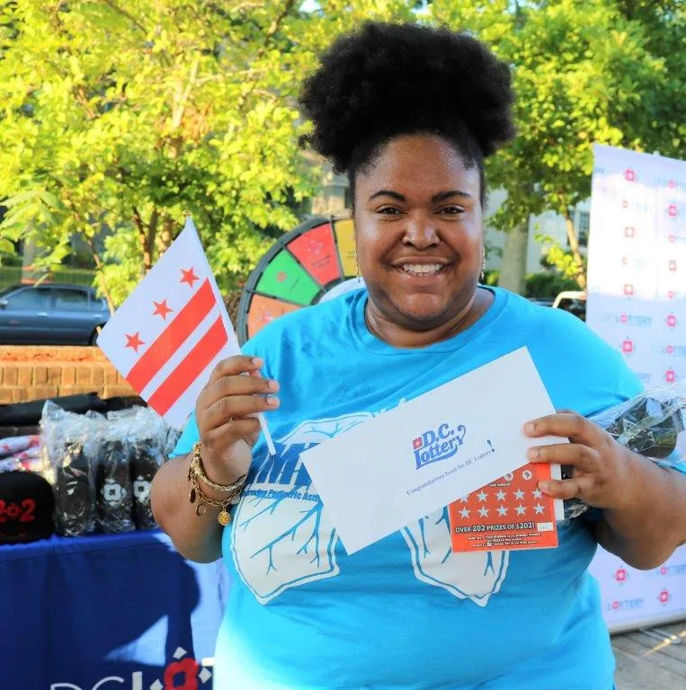 Player posing with prize